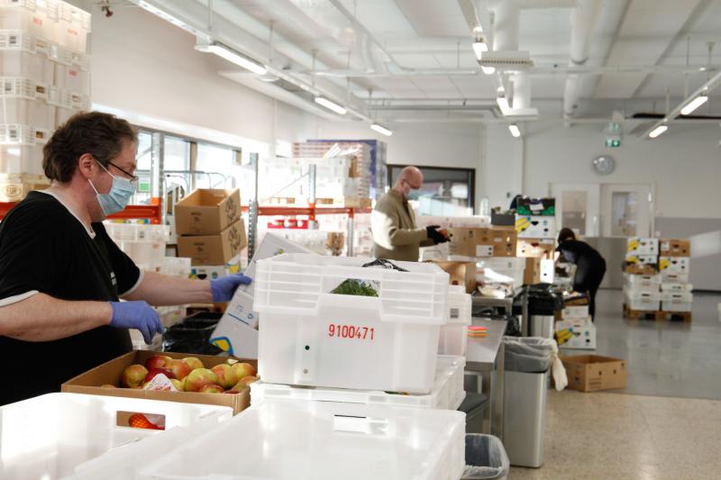 Personnel sorting food waste at Stadin safka’s food waste terminal.